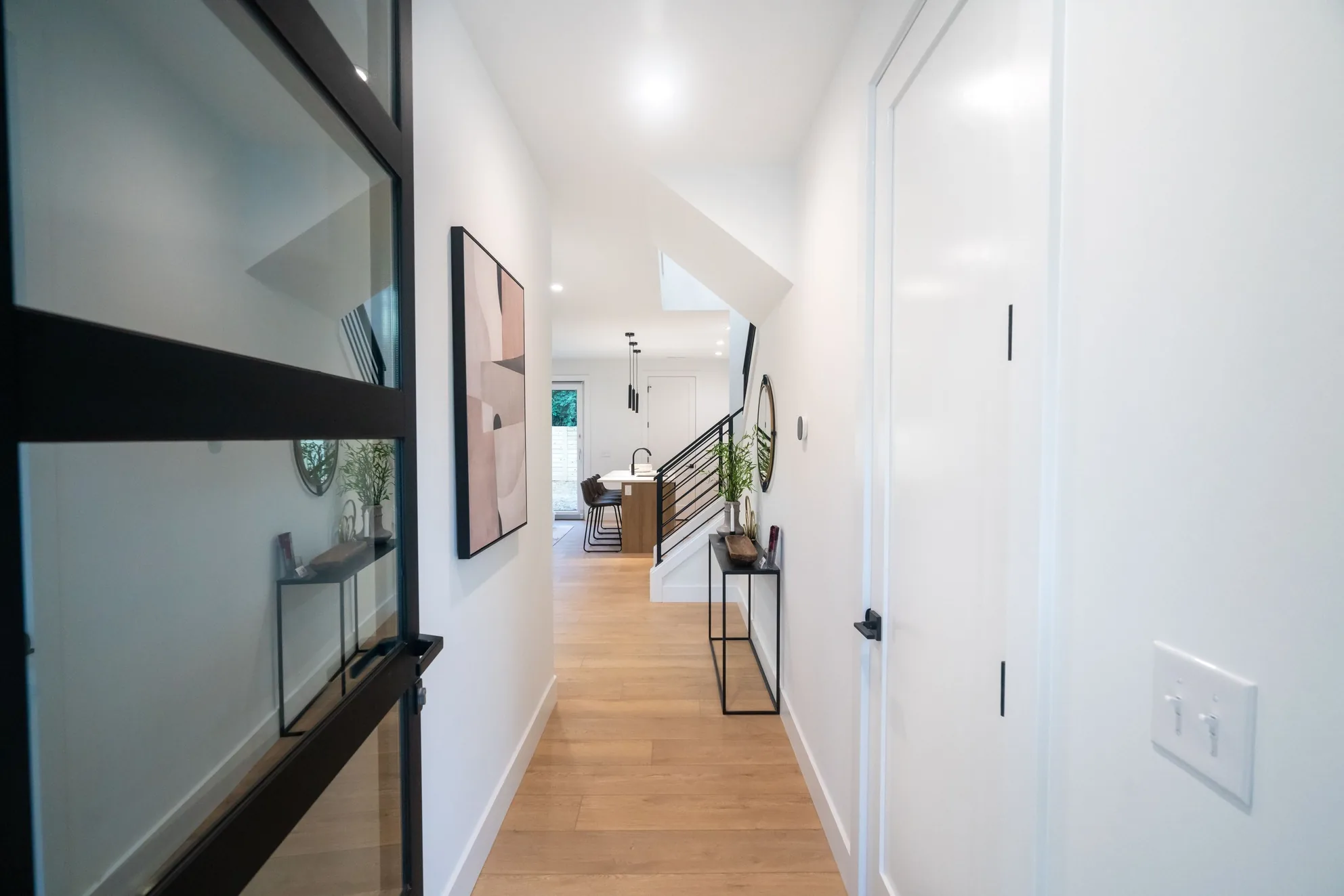 Entry hall with wood floors in a remodeled Charlotte home